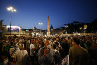 People stage a protest against the COVID-19 vaccination pass in Rome, Wednesday, July 28, 2021. Italy's government approved a decree ordering the use of the so-called "green" passes starting on Aug. 6. To be eligible for a pass, individuals must prove they have received at least one vaccine dose in the last nine months, recovered from COVID-19 in the last six months or tested negative in the previous 48 hours. (Cecilia Fabiano/LaPresse via AP)