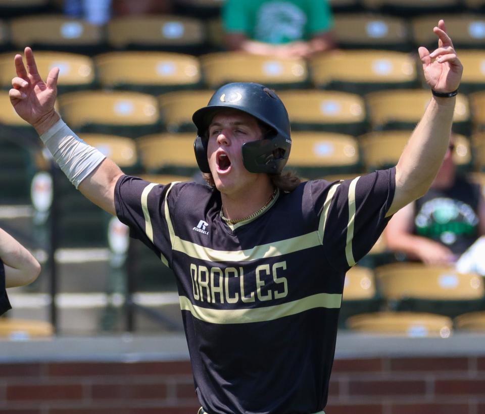 Chase Long celebrates after a scored run.