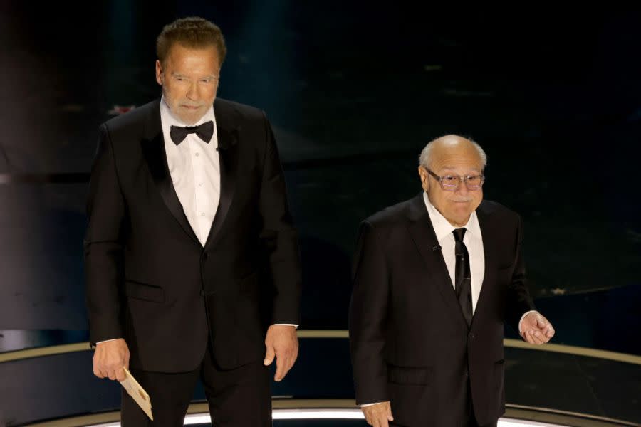 HOLLYWOOD, CALIFORNIA – MARCH 10: (L-R) Arnold Schwarzenegger and Danny DeVito speak onstage during the 96th Annual Academy Awards at Dolby Theatre on March 10, 2024 in Hollywood, California. (Photo by Kevin Winter/Getty Images)