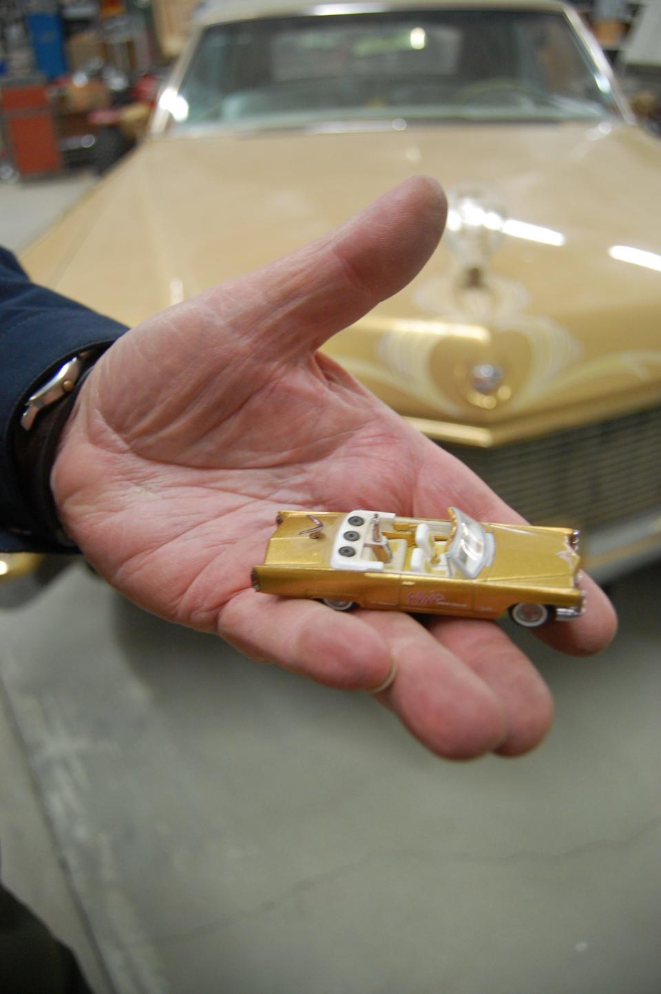 Tommy Bolack holds a Hot Wheels Legends version manufactured by Mattel Inc. of his 1965 Elvis Presley Dream Cadillac Eldorado.