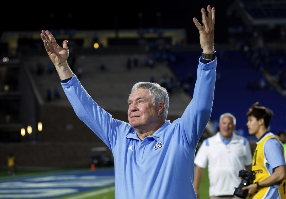 North Carolina coach Mack Brown gestures to fans after the team's win over Duke in an NCAA college football game in Durham, N.C., Saturday, Oct. 15, 2022. (AP Photo/Ben McKeown)