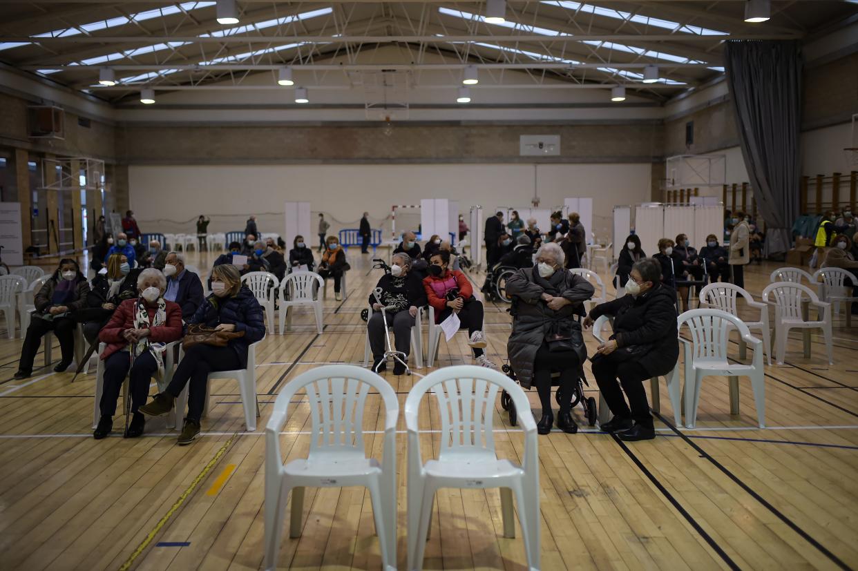 Residents wait 15 minutes after receiving a Pfizer vaccine during a COVID-19 vaccination campaign in Pamplona, northern Spain, Tuesday, March 2, 2021. The Navarra regional government has called around 3,400 residents of the city over the age of 80 to be vaccinated against COVID-19.