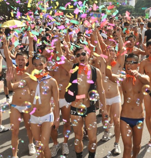 This file photo shows people marching on the streets during the annual gay parade in Taipei, in 2009. Same-sex unions are quietly coming down in Asia, with religion posing less of a hindrance than in the West
