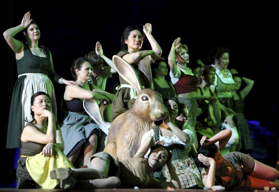 The undated photo provided by Landestheater Linz shows the choir of the Philip Glass opera 'The Lost' during a dress rehearsal in Linz, Austria. Glass wrote "The Lost"— "Spuren der Verirrten" for the new Linz opera house, where it world-premiered Friday, April 12, 2013. (AP Photo/Landestheather Linz, Ursula Kaufmann)