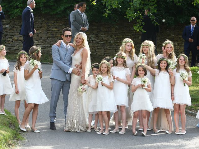 <p>Neil Mockford/FilmMagic</p> Kate Moss at her wedding to Jamie Hince with their bridesmaids, including her sister Lottie Moss, on July 1, 2011 in Southrop, England.