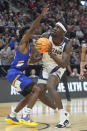 McNeese State guard Javohn Garcia, left, guards Gonzaga forward Graham Ike during the first half of a first-round college basketball game in the NCAA Tournament in Salt Lake City, Thursday, March 21, 2024. (AP Photo/Rick Bowmer)