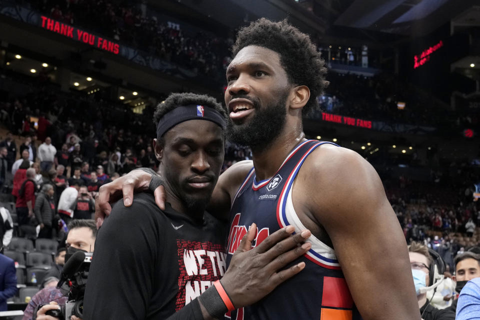 Toronto Raptors forward Pascal Siakam, left, and Philadelphia 76ers center Joel Embiid, right, embrace after Game 6 of an NBA basketball first-round playoff series in Toronto, Thursday, April 28, 2022. (Frank Gunn/The Canadian Press via AP)