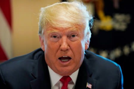 U.S. President Donald Trump addresses members of his cabinet and the news media as he holds a cabinet meeting at the White House in Washington, U.S., August 16, 2018.  REUTERS/Kevin Lamarque