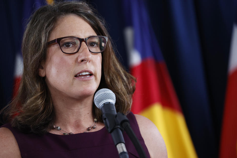 Jill Hunsaker Ryan, executive director of the Colorado Department of Public Health and Environment, makes a point during a news conference on the state's efforts against the new coronavirus Tuesday, July 21, 2020, in Denver.(AP Photo/David Zalubowski)