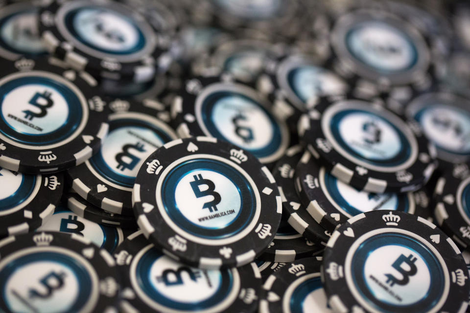 Casino gambling chips decorated with bitcoin logos sit on display at the CrytoSpace conference in Moscow, Russia, on Friday, Dec. 8, 2017. CryptoSpace is Eastern Europe’s largest conference dedicated to blockchain technology and cryptocurrencies and runs Dec. 8-9. Photographer: Andrey Rudakov/Bloomberg