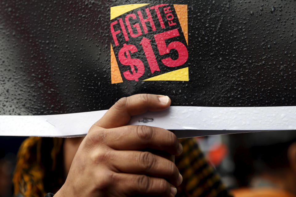 Fast-food workers and their supporters join a nationwide protest for higher wages and union rights outside McDonald's in the Harlem section of Manhattan in New York City, November 10, 2015. REUTERS/Mike Segar