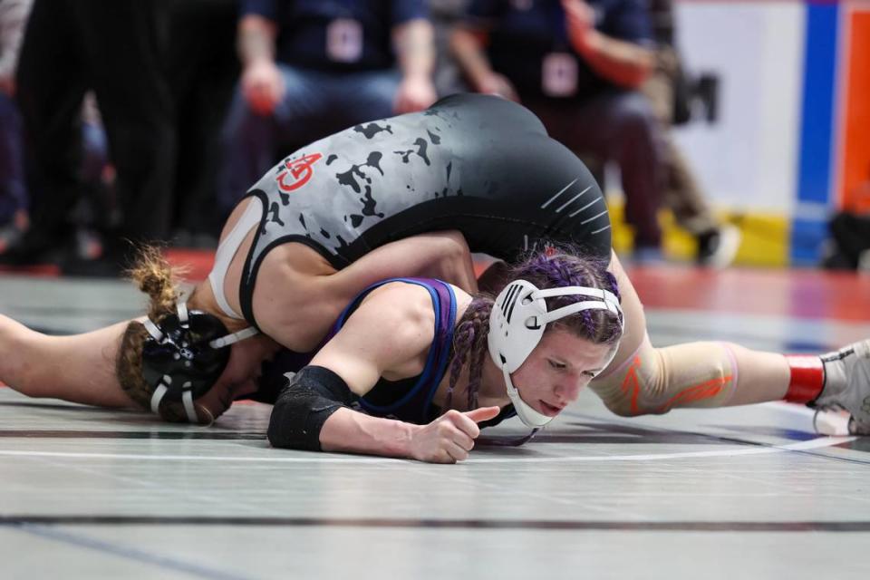 Cumberland Valley’s’ Eliana White-Vega controls Philipsburg-Osceola’s Isabella Duvall in the 124-pound PIAA girls semifinal match on Friday, March 8, 2024 at the Giant Center in Hershey.