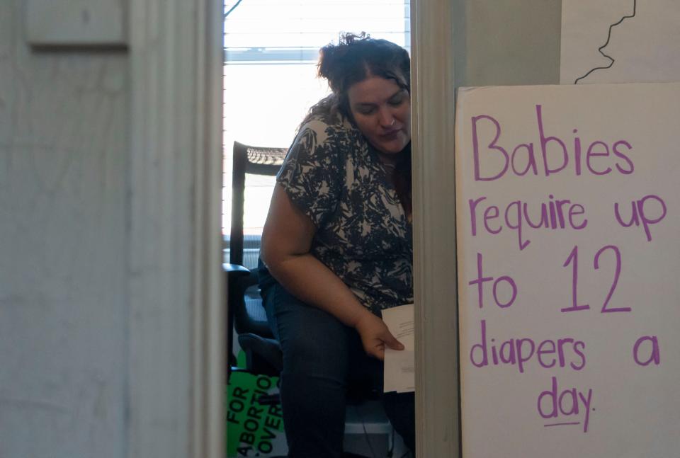 Jess Marchbank, the program director, sits down in her  office Monday, Oct. 3, 2022, at the All-Options Hoosier Diaper Program in Bloomington.