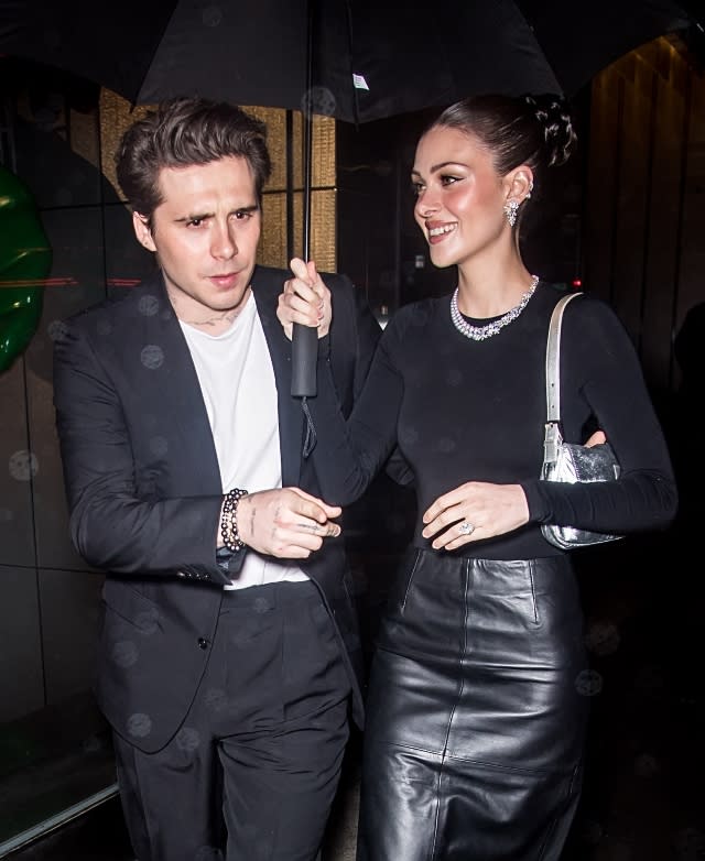 Nicola Pelts is wearing Mikimoto jewelry, a pair of boots by Marc Jacobs and carrying a silver Fendi baguette. 29 Apr 2023 Pictured: Brooklyn Beckham, Nicola Peltz.