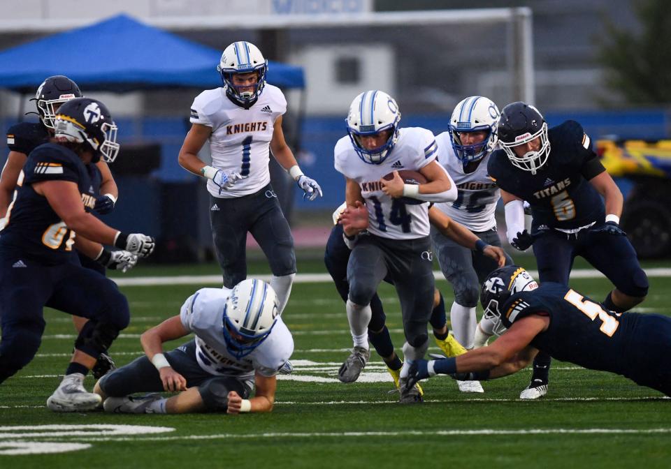 OÕGormanÕs Maverick Jones pushes through the pack with the ball during a football game on Friday, September 9, 2022, in Tea.