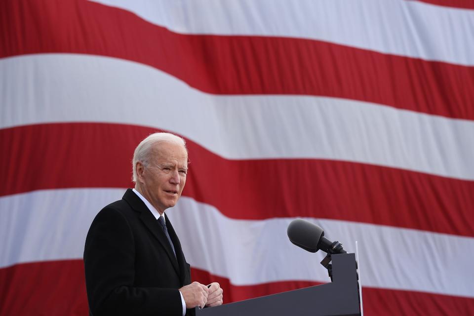 A day before his inauguration, Joe Biden delivers remarks on Jan. 19, 2021, at the Major Joseph R. 