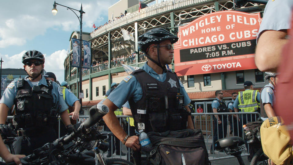 Police stand outside of Wrigley Field in “City So Real” - Credit: Chicago Story Film, LLC