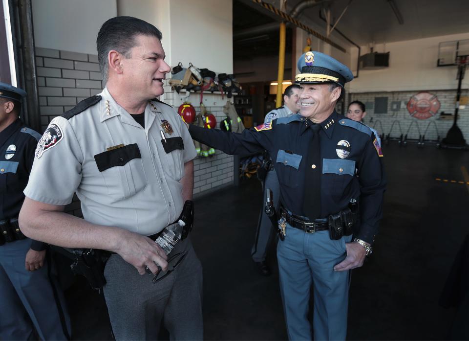 El Paso County Sheriff Richard Wiles, left, talks with El Paso police Chief Greg Allen during a 9/11 Memorial Ceremony in 2018 at Fire Station 18. Allen died Jan. 17.