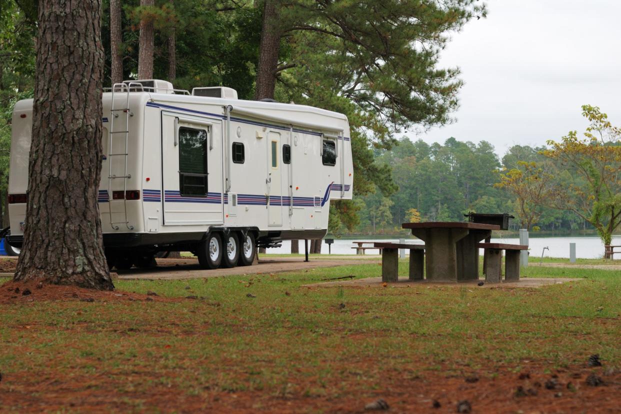 rv next to park table and grill