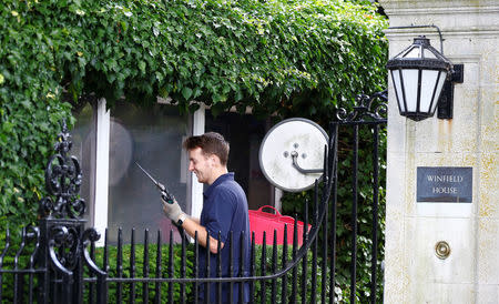 A man prepares to cut the ivy in the grounds of the U.S. ambassador's residence, ahead of the U.S. presidential visit, in Regents Park, London, Britain July 11, 2018. REUTERS/Henry Nicholls