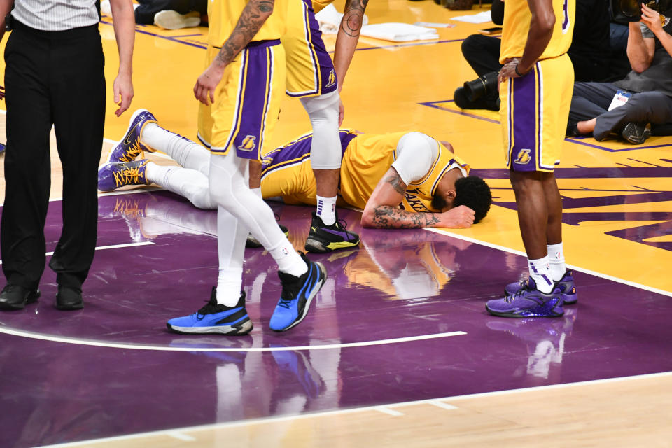 LOS ANGELES, CALIFORNIA - JANUARY 07: Anthony Davis #3 of the Los Angeles Lakers gets injured after taking a hard fall on his tail bone during the third quarter of a game against the New York Knicks at Staples Center on January 07, 2020 in Los Angeles, California. NOTE TO USER: User expressly acknowledges and agrees that, by downloading and/or using this photograph, user is consenting to the terms and conditions of the Getty Images License Agreement.  (Photo by Allen Berezovsky/Getty Images,)