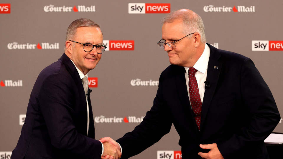 Anthony Albanese and Scott Morrison shaking hands in the first leaders debate in which they discussed the rising cost of living.