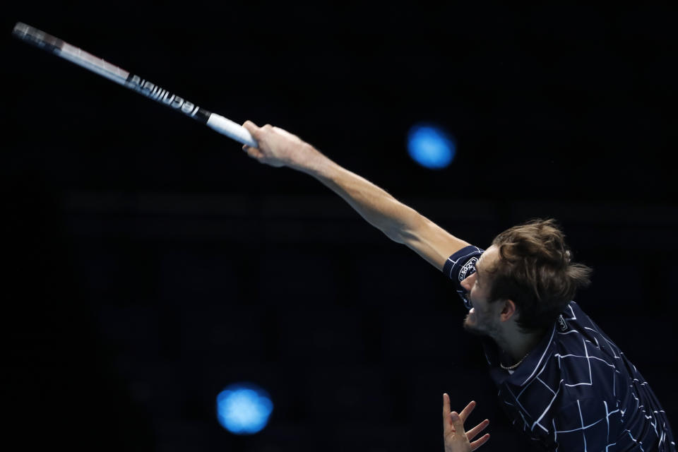 Daniil Medvedev of Russia serves to Dominic Thiem of Austria during their singles final tennis match at the ATP World Finals tennis tournament at the O2 arena in London, Sunday, Nov. 22, 2020. (AP Photo/Frank Augstein)