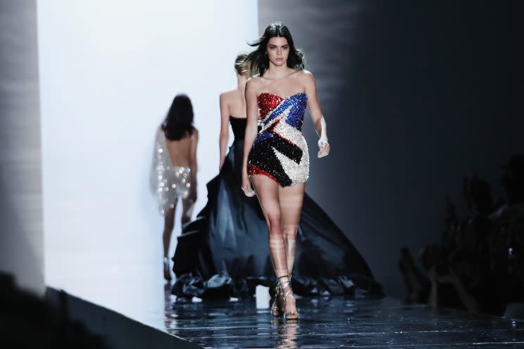 Kendall Jenner wore a red, white, and blue (and black) super mini dress on the runway. (Photo: Getty Images)