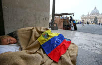 Lilian Tintori, wife of jailed Venezuelan opposition leader Leopoldo Lopez, sleeps on the pavement near St. Peter's Square in Rome, Italy December 6, 2016. REUTERS/Stefano Rellandini