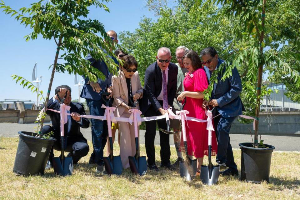 Congresswoman Doris Matsui reacts as the ribbon pulls the cherry tress together at the groundbreaking for the Hanami Line project at Robert T. Matsui Park on Thursday, June 29, 2023. Consul General of Japan Noguchi Yasushi held the ribbon to prevent one tree from tipping over as Sacramento Mayor Darrell Steinberg helped with ribbon cutting. The Hanami Line will be Sacramento’s first cherry blossom park connecting Sacramento’s love of trees with the rich cultural heritage of the region along the Sacramento River. The Hanami Line is projected to open in 2024. Paul Kitagaki Jr./pkitagaki@sacbee.com