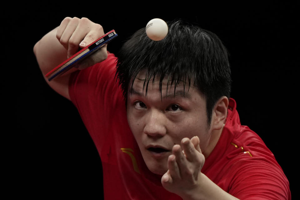 China's Fan Zhendong serves the ball to South Korea's Jang Woojin in the Table Tennis Men's Singles semi-final match for the 19th Asian Games in Hangzhou, Monday, Oct. 2, 2023. (AP Photo/Ng Han Guan)