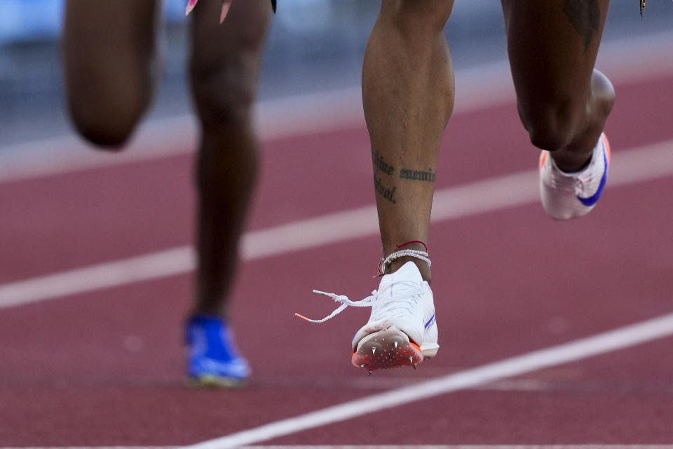 Sha'Carri Richardson wins a heat women's 100-meter run as her shoe appears to come untied during the U.S. Track and Field Olympic Team Trials Friday, June 21, 2024, in Eugene, Ore. (AP Photo/Charlie Neibergall)