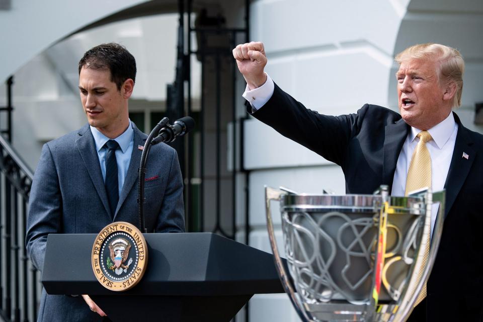 2018 NASCAR Cup Series Champion Joey Logano listens while US President Donald Trump speaks during an event on the South Lawn of the White House  April 30, 2019, in Washington, DC. (Photo by Brendan Smialowski / AFP)        (Photo credit should read BRENDAN SMIALOWSKI/AFP via Getty Images)