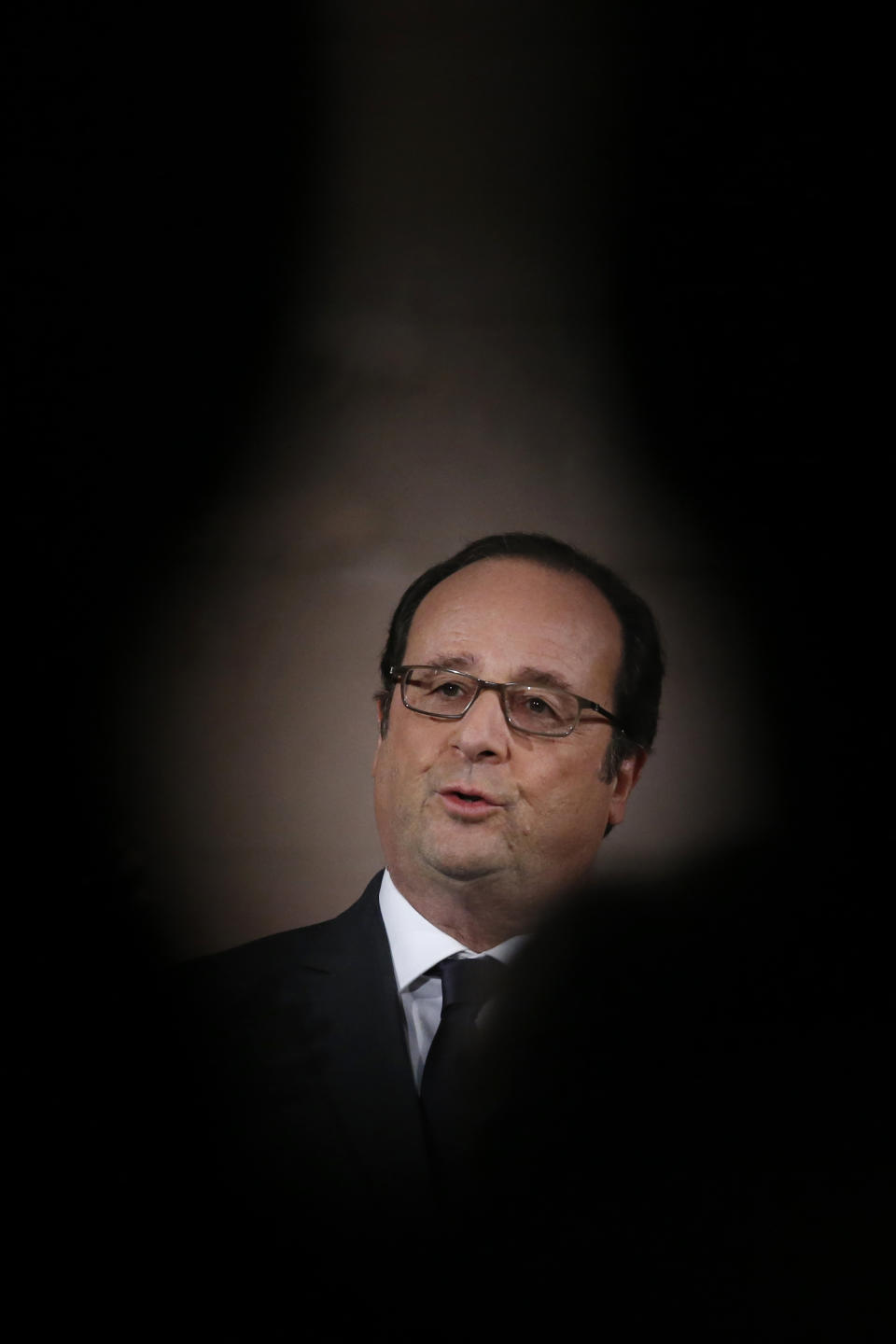 French President Francois Hollande delivers a speech after a visit to the exhibition, ''Mission Ile de la Cite, Le coeur du coeur'' (Mission Ile de la Cite: the heart of the heart) in Paris, Tuesday, Feb. 14, 2017. (Gonzalo Fuentes, Pool via AP)