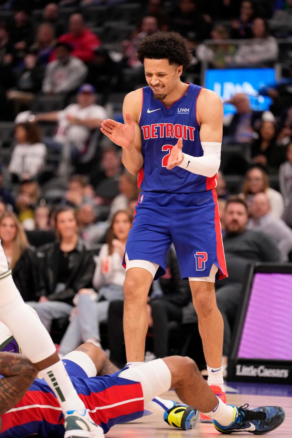 Detroit Pistons guard Cade Cunningham (2) claps his hands after a play during the second quarter against the Milwaukee Bucks at Little Caesars Arena.