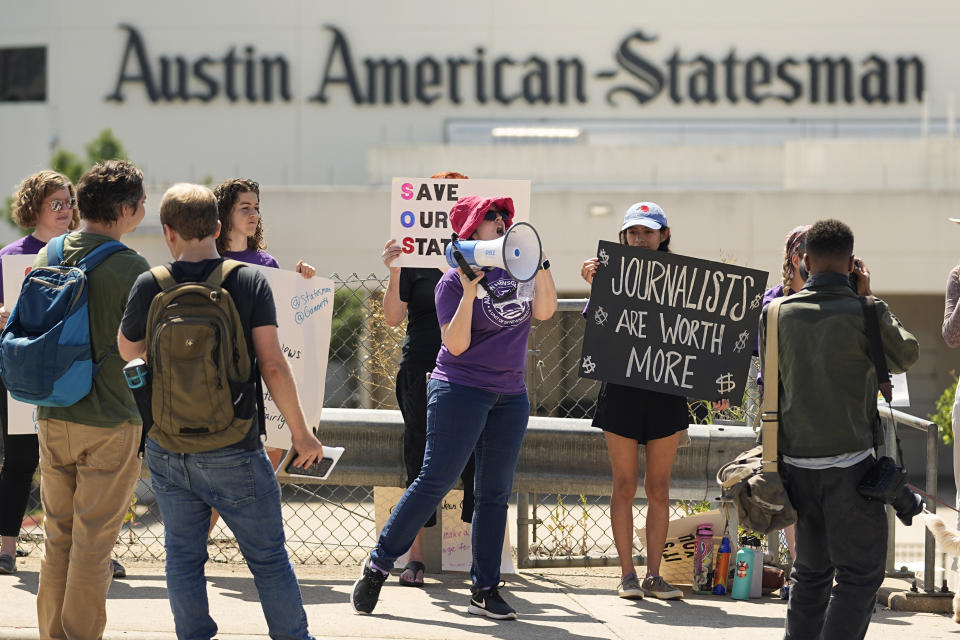 Editorial members of the Austin American-Statesman's Austin NewsGuild picket along the Congress Avenue bridge in Austin, Texas, Monday, June 5, 2023. The mostly one-day strike aims to protest the company's leadership and cost-cutting measures imposed since its 2019 merger with GateHouse Media. (AP Photo/Eric Gay)