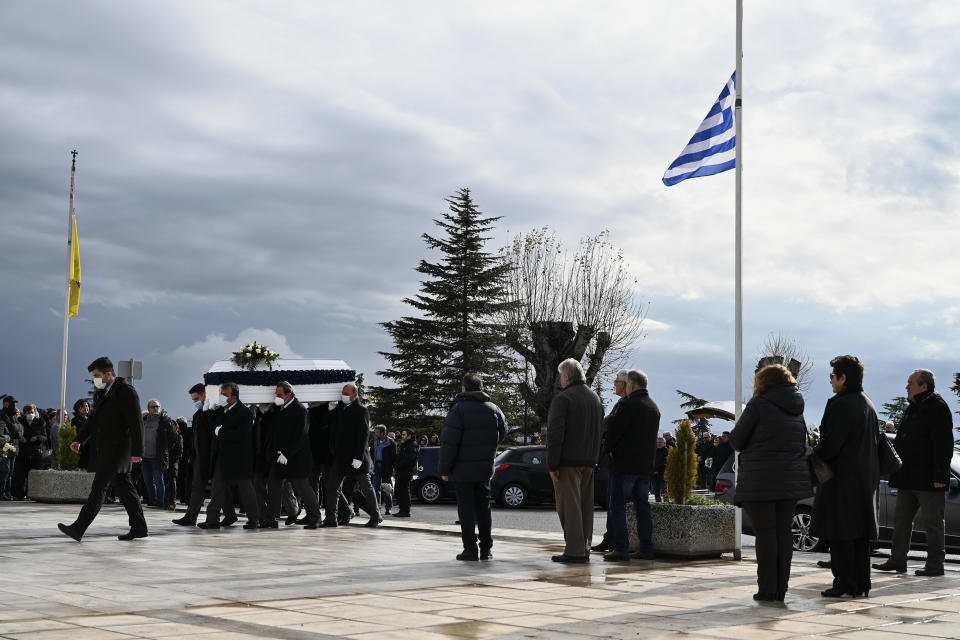 Pallbearers carry the coffin of Sotiris Karageorgiou, one of the victims of a train collision, during a funeral procession, in Thessaloniki, northern Greece, Saturday, March 4, 2023. More than 50 people — including several university students — died when a passenger train slammed into a freight carrier just before midnight Tuesday. The government has blamed human error and a railway official faces manslaughter charges. (AP Photo/Giannis Papanikos)