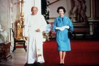 <p>Pope John Paul II, the head of the Catholic church, paid a visit to Buckingham Palace to meet with the Queen of England, who is the head of the church of England.</p>