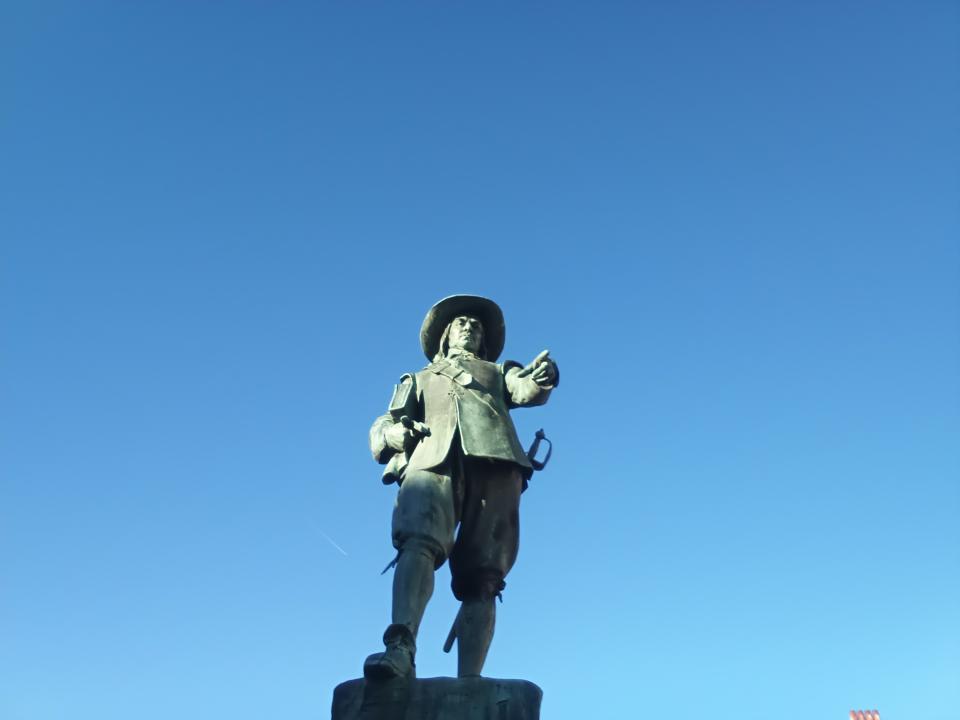 Statue in front of a blue sky