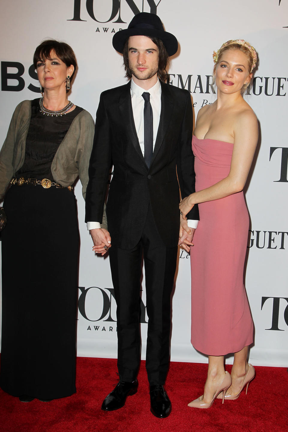 This image released by Starpix shows Tom Sturridge, center, his mother Phoebe Nicholls, left, and Sienna Miller at the 67th Annual Tony Awards in New York on Sunday, June 9, 2013. (AP Photo/Starpix, Amanda Schwab)