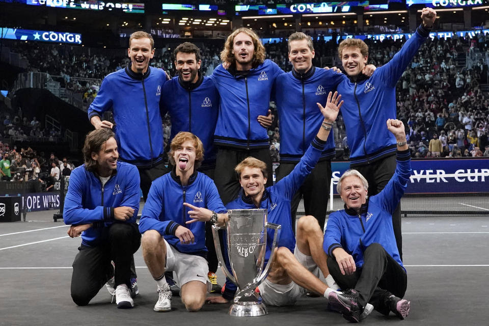 Team Europe celebrates after they defeated Team World for the Laver Cup in tennis, Sunday, Sept. 26, 2021, in Boston. At top from left, are Daniil Medvedev, Mateo Berrettini, Stefanos Tsitsipas, vice captain Thomas Enqvist, and Casper Ruud. At bottom from left, Feliciano Lopez, Andrey Rublev, Alexander Zverev, and captain Bjorn Borg. (AP Photo/Elise Amendola)