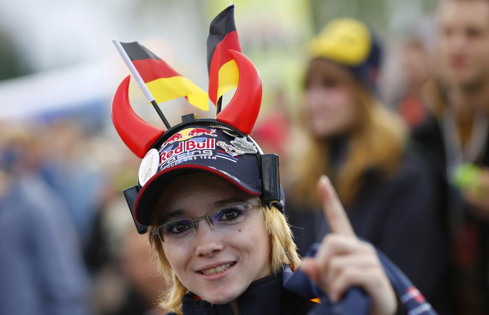 Supporter of Germany's Red Bull Formula One driver Sebastian Vettel reacts at start of Formula One Grand Prix of India at public viewing session in Heppenheim