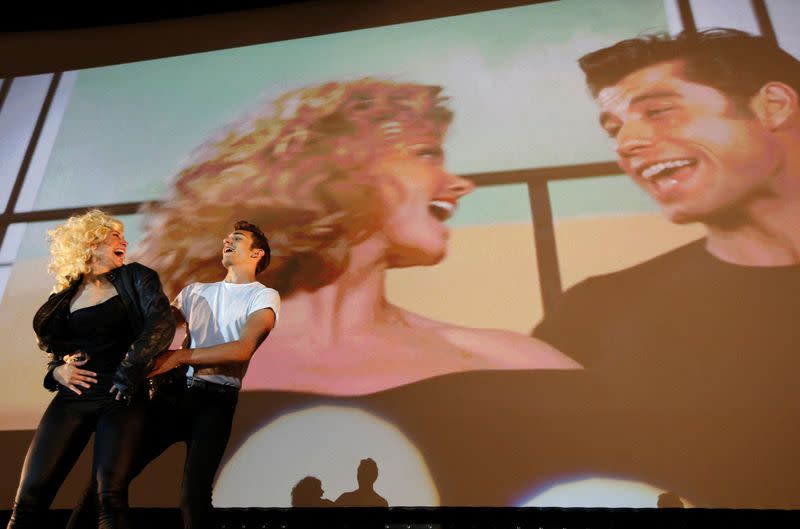 FILE PHOTO: Dancers perform during the final scene of the Future Cinema outdoor screening of the 1978 film "Grease" in Barnes