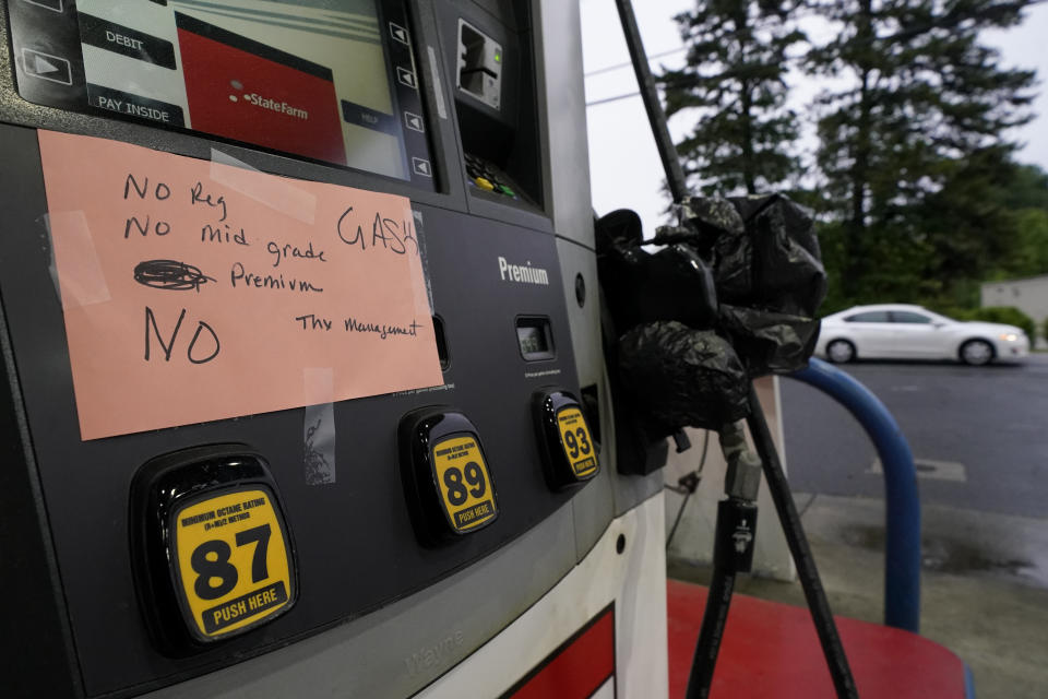 A hand written sign is posted on a gas pump, showing that the service station is out of all grades of fuel Wednesday, May 12, 2021, in Charlotte, N.C. Several gas stations in the Southeast reported running out of fuel, primarily because of what analysts say is unwarranted panic-buying among drivers, as the shutdown of a major pipeline by hackers entered its fifth day. (AP Photo/Chris Carlson)