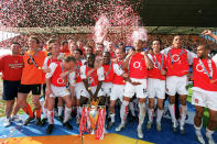 Reyes and Arsenal celebrate the 2003-04 Premiership title triumph (Photo by Stuart MacFarlane/Arsenal FC via Getty Images)