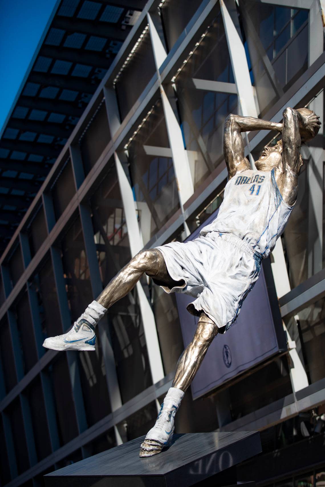 Dirk Nowitzki’s statue is unveiled during the “All Four One” statue ceremony in front of the American Airlines Center in Dallas, Sunday, Dec. 25, 2022. (AP Photo/Emil T. Lippe)