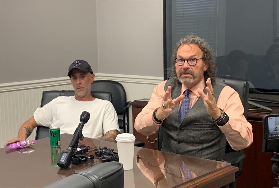 Trent Taylor Sr. (left) and attorney David Mour discuss the May 2023 shooting at Shively Animal Clinic that killed Trent Taylor Jr. June 21, 2023