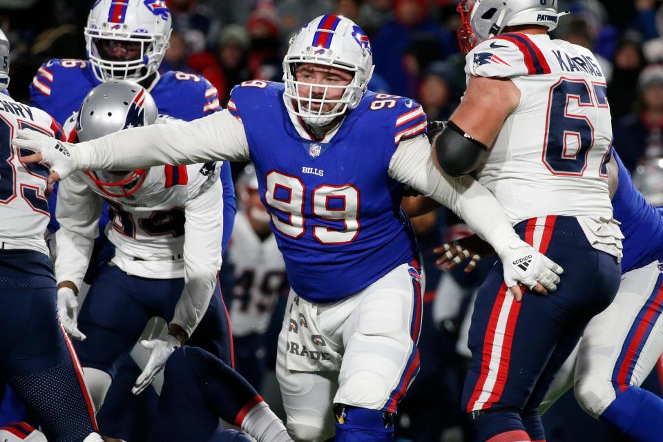 Buffalo Bills defensive tackle Harrison Phillips (99) celebrates a tackle during the first half of an NFL football game against the New England Patriots in Orchard park, N.Y., Monday Dec. 6, 2021. (AP/ Photo Jeffrey T. Barnes)
