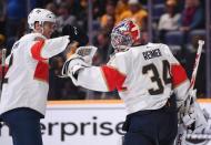 Jan 19, 2019; Nashville, TN, USA; Florida Panthers goaltender James Reimer (34) and Florida Panthers defenseman Josh Brown (2) celebrate after a win against the Nashville Predators at Bridgestone Arena. Mandatory Credit: Christopher Hanewinckel-USA TODAY Sports