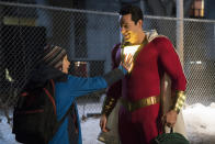 This image released by Warner Bros. shows Zachary Levi, right, and Jack Dylan Grazer in a scene from "Shazam!" (Steve Wilkie/Warner Bros. Entertainment via AP)